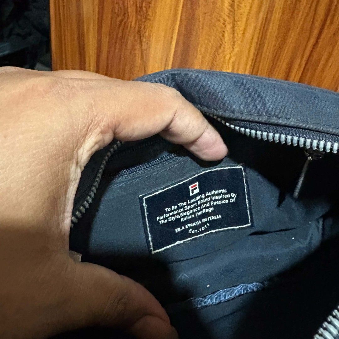 Fila sling bag (Category: Sling Bags) located in Carmen. Submitted by aquarius.00 (Listing ID 1466055089, Image 2). Description: flaws kita sa pics malinis loob kasya cellphone.