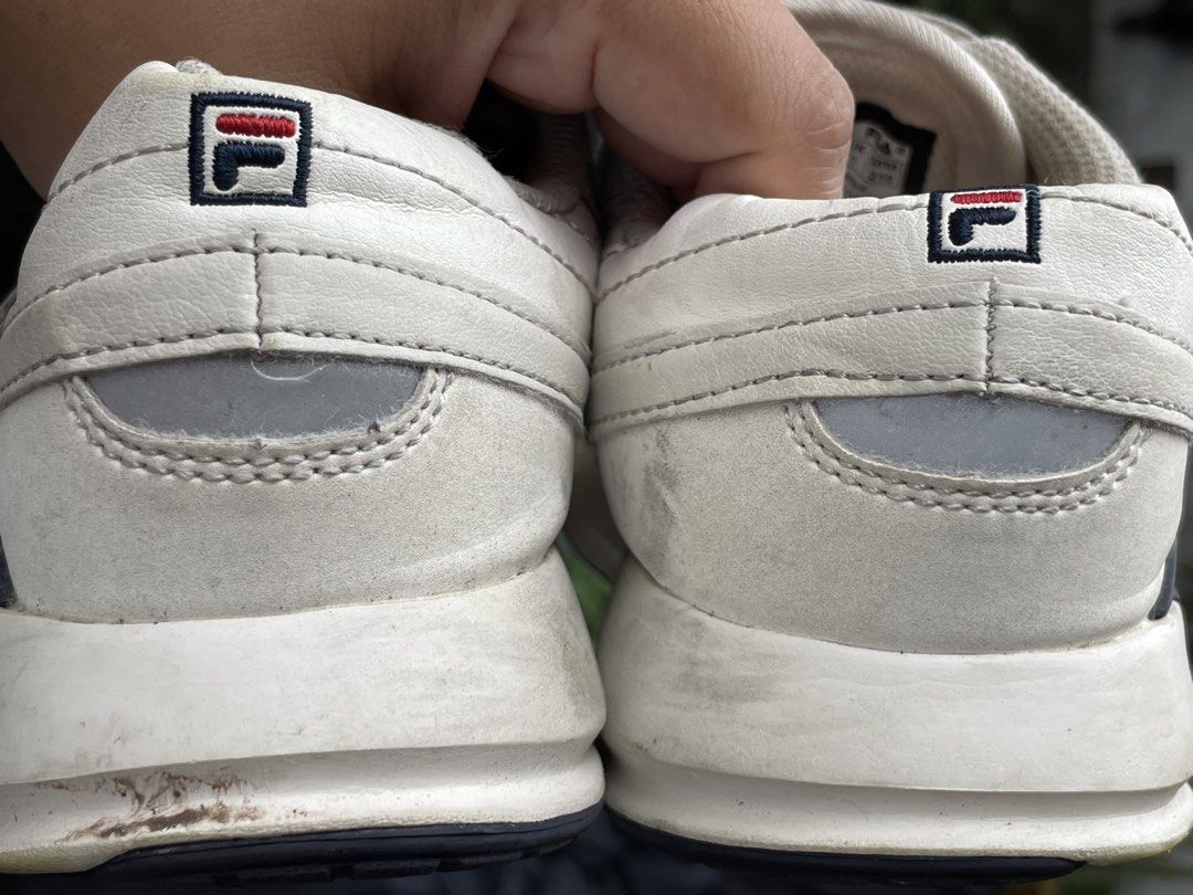 Fila White Sneakers Size US 2 / EU 33.5 (Category: Sneakers) located in Zamboanga. Submitted by stephoney03 (Listing ID 1466038026, Image 3). Description: - Brand: Fila Kids Sneakers - Color: White - Size: US 2 | EUR 33.5 | UK 1 | MM 210 - Closure: Velcro strap and lace-up front - Materials: Synthetic upper, textile lining, rubber outsole - Branding: Fila logo on side, tongue, heel, and sole - Condition: Pre-loved with visible scuff marks and dir