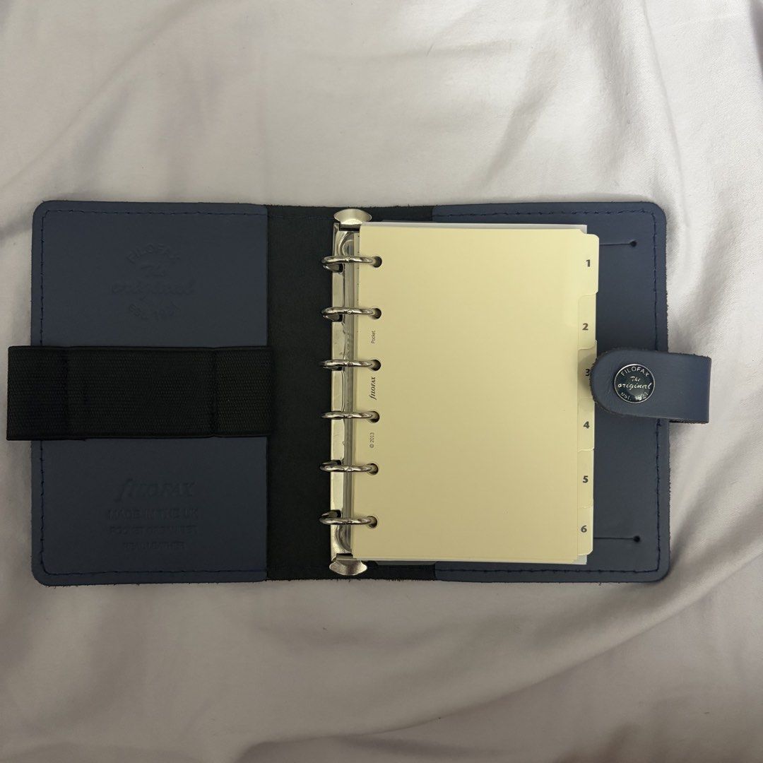 filofax original pocket midnight blue (Category: Other Stationery & Craft) located in Las Pinas. Submitted by jellybeans45 (Listing ID 1465982956, Image 2). Description: • filofax original pocket size (6 rings) — 3000 — like new — no scratches, etc — with inserts from 2024, will be adding finance trackers and other inserts too.