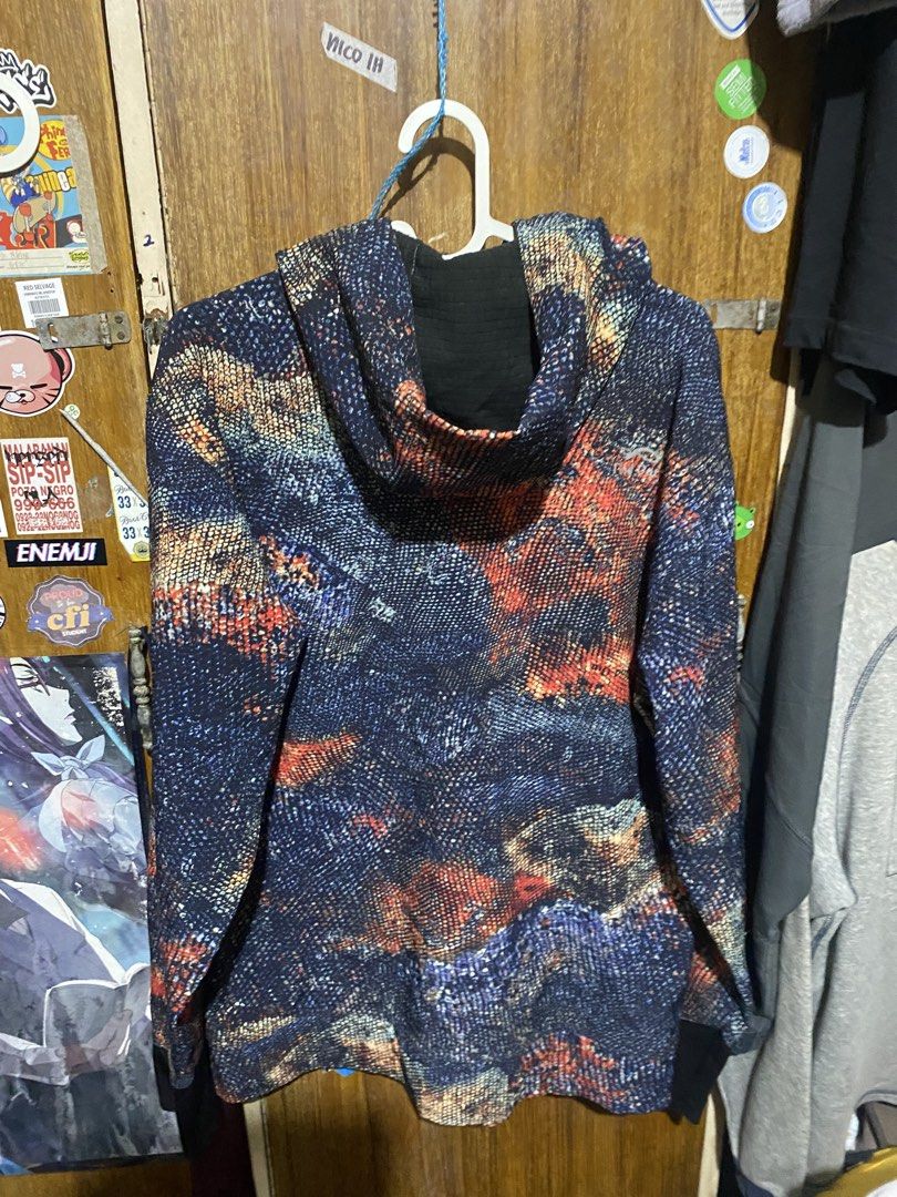 Find-Out Patterned Zip-Up Hoodie (Category: Hoodies) located in Imus. Submitted by frootiloots4103 (Listing ID 1466029870, Image 2). Description: Find-Out zip hoodie with full front zipper and hood. Dark base fabric featuring multi-color textured patterns in orange, blue, and yellow. Includes front hand pockets and adjustable drawstrings at the neckline. Ribbed cuffs keep sleeves secure. Great outerwear piece for chilly days. -23x29 OPEN FOR NEGO