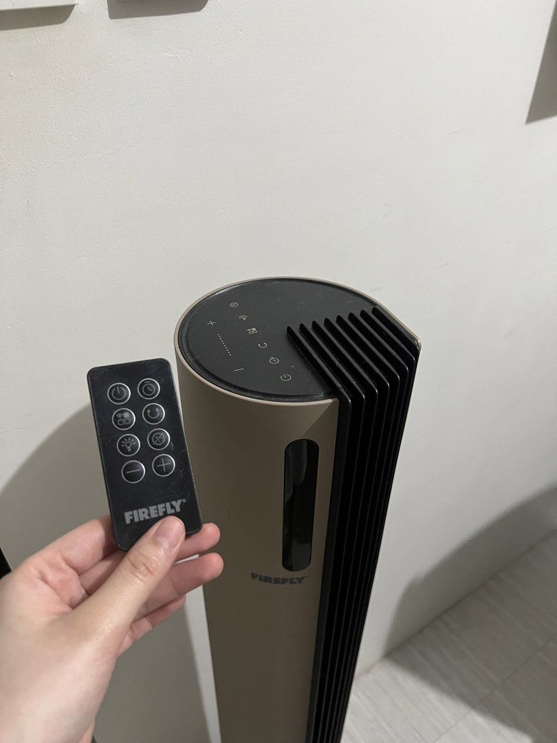 Firefly Tower Fan with Remote Control (Category: Fans) located in Quezon City. Submitted by styleandcomfort (Listing ID 1466059771, Image 3). Description: Barely used Original price: 7,500 SUPER AESTHETIC AND UNIQUE! - Brand: Firefly Tower Fan - Color: Stylish beige and black - Control: Includes matching multi-function remote and digital top panel - Performance: Great airflow speed options with quiet operation - Design: Space-saving vertical buil