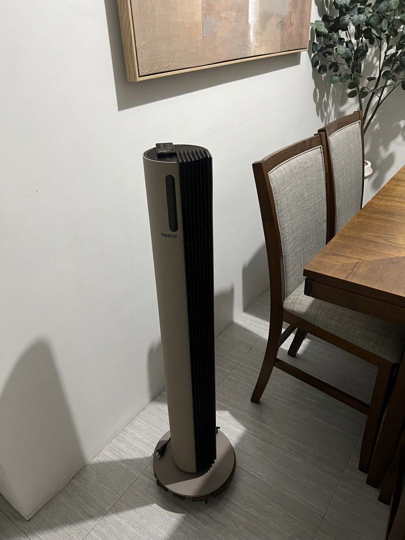 Firefly Tower Fan with Remote Control (Category: Fans) located in Quezon City. Submitted by styleandcomfort (Listing ID 1466059771, Image 2). Description: Barely used Original price: 7,500 SUPER AESTHETIC AND UNIQUE! - Brand: Firefly Tower Fan - Color: Stylish beige and black - Control: Includes matching multi-function remote and digital top panel - Performance: Great airflow speed options with quiet operation - Design: Space-saving vertical buil