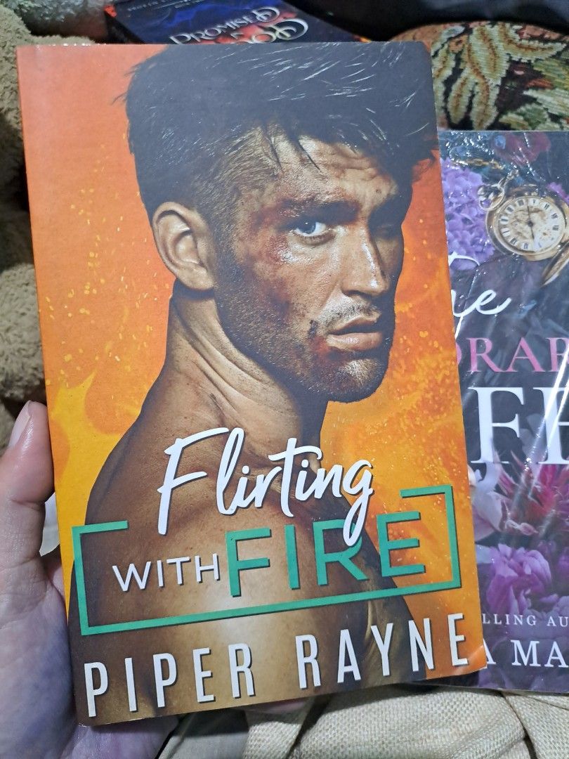 Flirting with Fire by Piper Rayne Paperback Novel (Category: Storybooks) located in Quezon City. Submitted by booksaremyimagination (Listing ID 1466044129, Image 1). Description: - Title: Flirting with Fire by Piper Rayne - Edition: Paperback with vibrant orange cover - Special Feature: Authentic author signature inside the front page in pink ink - Genre: Contemporary romance - Condition: Well-maintained, great for collectors and book lovers.