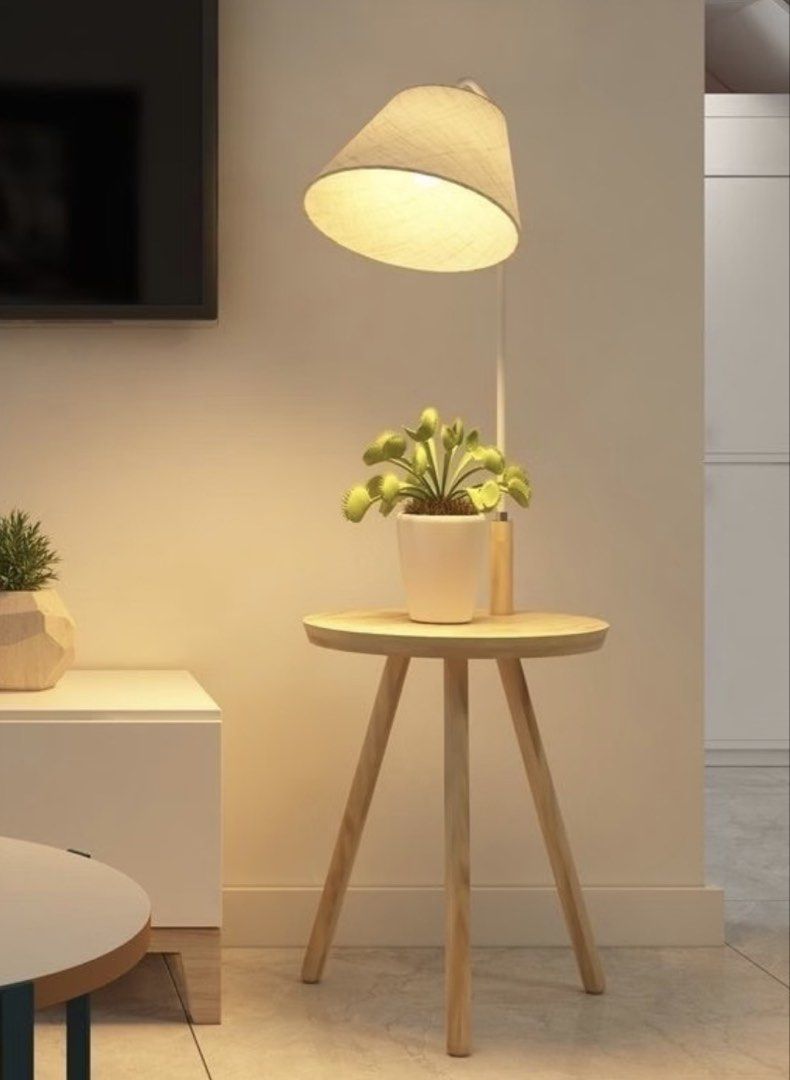 Floor lamp with table (Category: Other Home Decor) located in Iloilo. Submitted by kprior.hi (Listing ID 1466058536, Image 1). Description: Good as new, bought from orange app around 1,200. No flaws.
