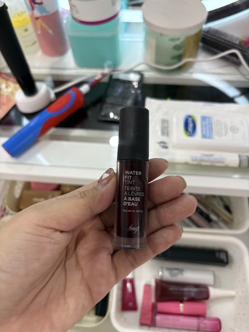 fmgt Water Fit Tint (Category: Makeup) located in Manila. Submitted by monstershaaa (Listing ID 1466123965, Image 1). Description: - Brand: fmgt water fit tint - Shade: Deep red - Condition: Brand new / Full tube - Net Weight: 5g - Formula: Lightweight, perfect for everyday wear - Size: Handy and travel-friendly for makeup pouches - Reason for selling: Decluttering unused makeup items.