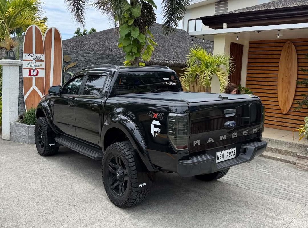 Ford Ranger (Category: Used Cars) located in Quezon City. Submitted by johnola69 (Listing ID 1466101785, Image 2). Description: FORD RANGER WILDTRAK 2.0 4x2 Automatic Bi-Turbo 2017 model: 68k low mileage. First Owned. VLAND tail lights New ditch light Nov sight installed Feb 2026 20' Fuel wheels/mags New 35x12.5x20 Venom tires Swamp thing A/T. installed Feb 2026. DOT 25 2025. 99% New Ride max 2' lift suspension + Lovelle spring New OEM Upper cont