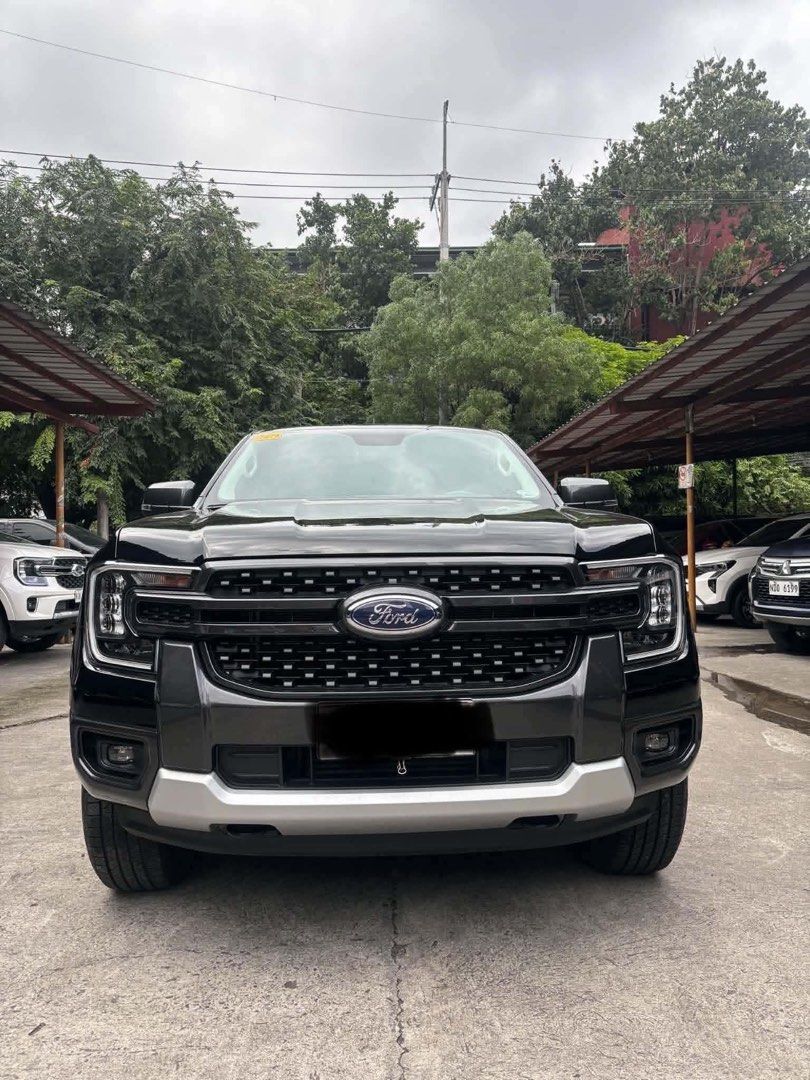 Ford Ranger Sport 2025 (Category: Used Cars) located in Kawit. Submitted by markuzmathers (Listing ID 1466059330, Image 2). Description: 2025 Ford Ranger Sport 1,410,000 only FREE interior and exterior detailing FREE transfer of ownership - 2.0L turbo diesel engine - Automatic transmission - 11k kms only - 6 plate ending Cashout: 312,600 Includes downpayment, chattel mortgage fee and partial insurance payment 5 years - 37,169 4 years - 40,667 3 y