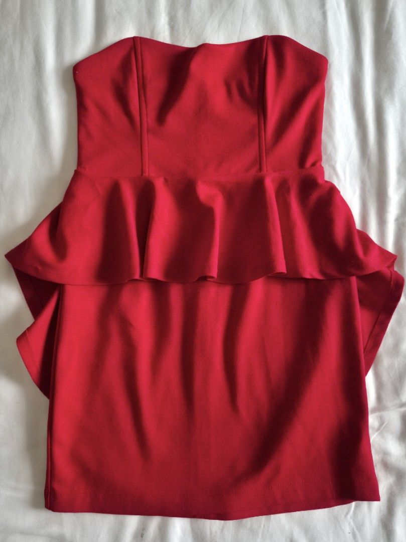 FOREVER21 Red strapless peplum mini dress (Category: Dresses) located in Quezon City. Submitted by corrnic (Listing ID 1466036593, Image 2). Description: - Color: Bright red - Style: Strapless bodycon dress with structured peplum waist and heart-shaped neckline - Closure: Exposed back zipper - Fit: Soft, stretchy fabric that hugs your curves - Measurements: 14" chest width, 14" total length - Occasion: Perfect for parties and nights out.