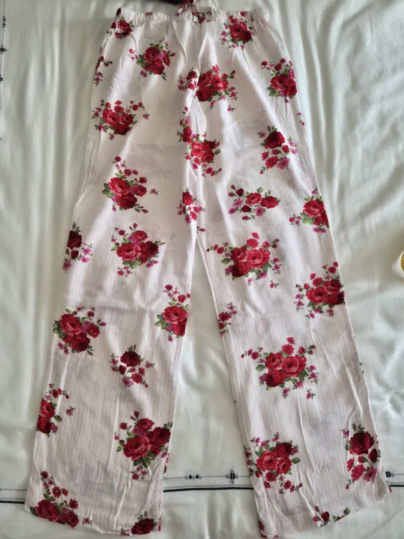Forever 21 Floral Print Drawstring Pants Size S (Category: Undergarments & Loungewear) located in Quezon City. Submitted by corrnic (Listing ID 1466016653, Image 3). Description: Forever 21 pants in white with a red rose floral pattern all over. High rise fit with an elastic waistband and front drawstring closure. Lightweight fabric, straight leg cut. Tag size small..