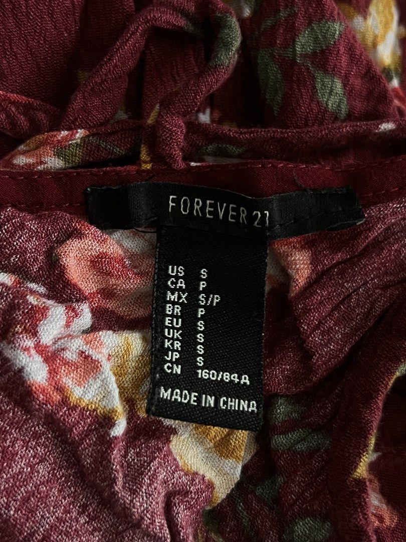 Forever 21 Maroon Floral Cami Top - Size S (Category: Sleeveless) located in Cainta. Submitted by thrift.reset (Listing ID 1466034204, Image 3). Description: - Adjustable thin camisole straps with criss-cross caged back detailing. - Lightweight, breezy woven fabric with a comfortable flowy fit. - Perfect for casual everyday wear, layering, or summer style. Last price posted. Thank you..