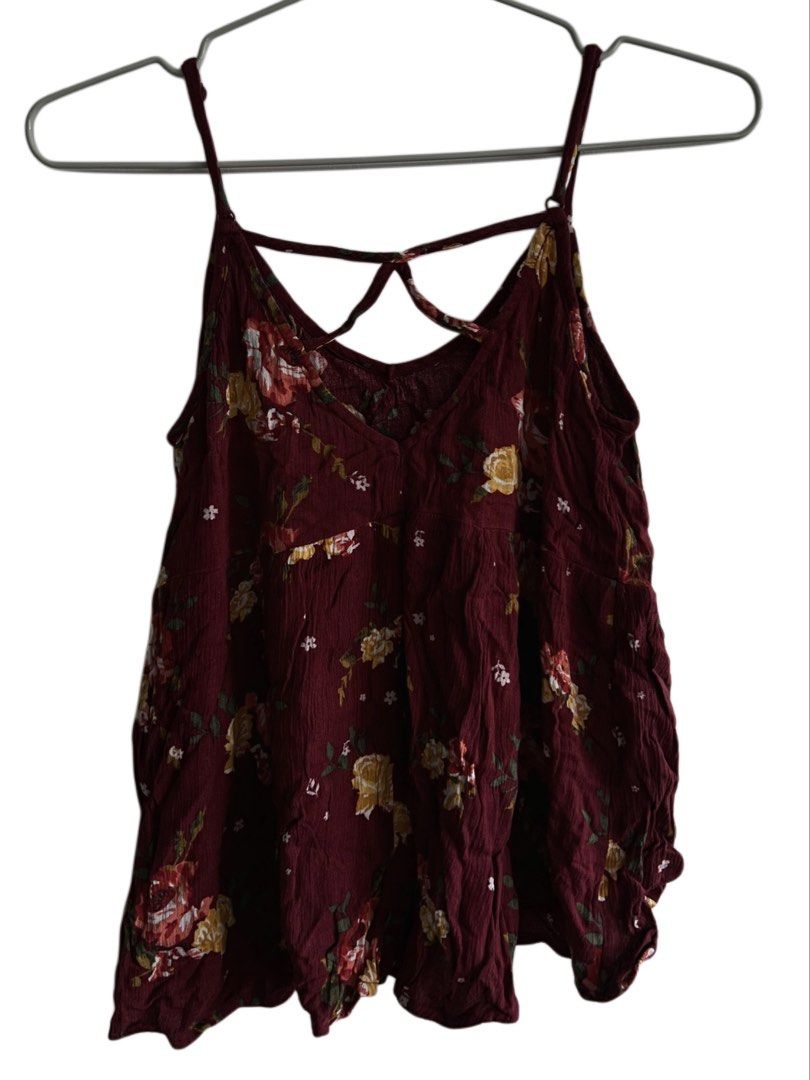 Forever 21 Maroon Floral Cami Top - Size S (Category: Sleeveless) located in Cainta. Submitted by thrift.reset (Listing ID 1466034204, Image 2). Description: - Adjustable thin camisole straps with criss-cross caged back detailing. - Lightweight, breezy woven fabric with a comfortable flowy fit. - Perfect for casual everyday wear, layering, or summer style. Last price posted. Thank you..