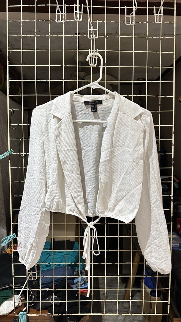 Forever 21 White Cropped Blazer Top Size S (Category: Coats, Jackets and Outerwear) located in Quezon City. Submitted by nsseller (Listing ID 1466108730, Image 1). Description: - Brand: Forever 21 Contemporary - Color: White - Size: S (160/84A) - Style: Long sleeves, lapel collar, front tie closure, crop top - Material: Textured fabric - Origin: Made in Vietnam.