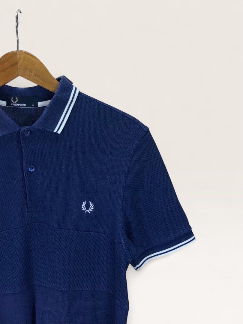 Fred Perry Navy Polo Shirt Size S (Category: Tshirts & Polo Shirts ) located in Manila. Submitted by 12essentials (Listing ID 1466013503, Image 3). Description: 📌 Very Good Condition 📌 S on tag 📌 Length 28’ Width 17’ Authentic navy blue Fred Perry polo shirt in size S. Features the classic white twin tipping, embroidered Laurel Wreath logo, and a stylish contrast textured front panel. PM to order!.