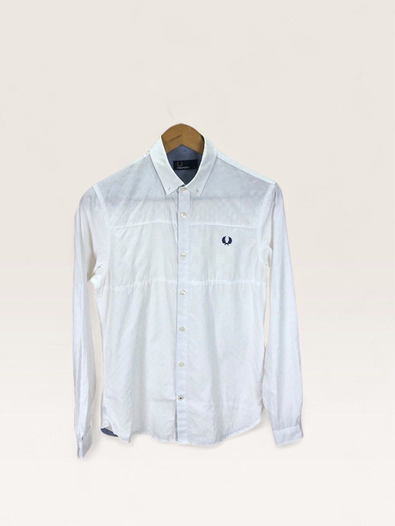 Fred Perry White Long Sleeve Button Down Shirt Size S (Category: Formal Shirts) located in Manila. Submitted by 12essentials (Listing ID 1466028299, Image 1). Description: 📌 Excellent Condition 📌 S on tag 📌 Length 28’ Width 19.5’- Brand: Fred Perry - Item: Long sleeve button-down shirt - Color: White with blue inner neck contrast - Size: Small (S) on tag - Details: Textured grid pattern, navy embroidered laurel wreath logo on chest, button cuf