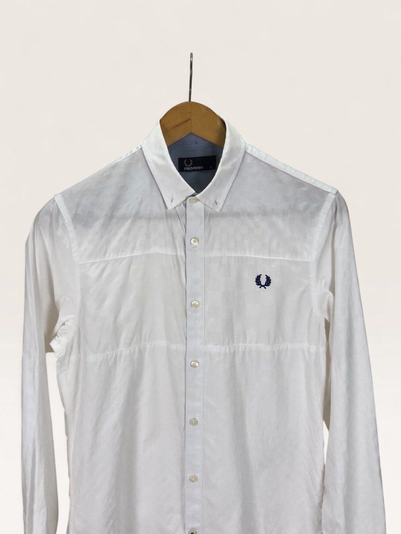Fred Perry White Long Sleeve Button Down Shirt Size S (Category: Formal Shirts) located in Manila. Submitted by 12essentials (Listing ID 1466028299, Image 2). Description: 📌 Excellent Condition 📌 S on tag 📌 Length 28’ Width 19.5’- Brand: Fred Perry - Item: Long sleeve button-down shirt - Color: White with blue inner neck contrast - Size: Small (S) on tag - Details: Textured grid pattern, navy embroidered laurel wreath logo on chest, button cuf