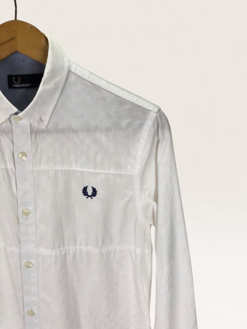 Fred Perry White Long Sleeve Button Down Shirt Size S (Category: Formal Shirts) located in Manila. Submitted by 12essentials (Listing ID 1466028299, Image 3). Description: 📌 Excellent Condition 📌 S on tag 📌 Length 28’ Width 19.5’- Brand: Fred Perry - Item: Long sleeve button-down shirt - Color: White with blue inner neck contrast - Size: Small (S) on tag - Details: Textured grid pattern, navy embroidered laurel wreath logo on chest, button cuf
