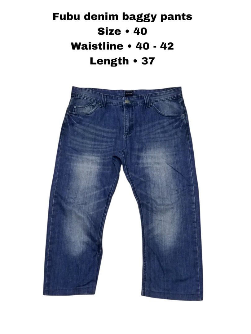 Fubu Denim Baggy Pants Size 40 (Category: Jeans) located in Magdalena. Submitted by magdalenathrift20 (Listing ID 1466085839, Image 1). Description: - Brand: Fubu - Style: Classic blue wash denim baggy pants - Size: Tag 40 (Actual waistline measures 40 to 42 inches) - Length: 37 inches - Material: 100% Cotton - Details: Branded metal button with engraved lettering, black Fubuthe Collection back waistband label, and contrast green stitching on bac