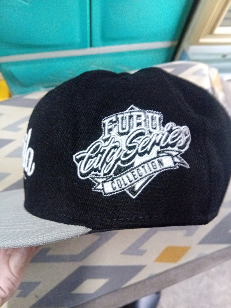 Fubu Snapback Cap (Category: Caps & Hats) located in Binangonan. Submitted by ohdievald38664 (Listing ID 1466032910, Image 2). Description: - Authentic - Purchased on August 20, 2026 on Fubu Flagship Store - Used like new. Isang beses lang nagamit. - Size: OSFM - Embroidered logo & design - Color: Black, Brim: Gray - 100% Cotton - No issue - RFS: Needs fund. - Location: Binangonan, Rizal Message if interested..