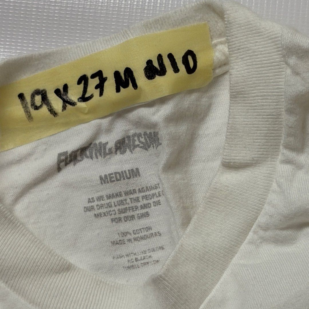 Fucking Awesome Graphic Tee White Medium (Category: Tshirts & Polo Shirts ) located in Manila. Submitted by johnedel_james (Listing ID 1466122380, Image 3). Description: - Brand: Fucking Awesome - Color: White - Size: Medium - Material: 100% cotton, made in Honduras - Design: Graphic print on front with FA lettering on the back of the jacket - Measurements: 19" pit to pit, 27" length.