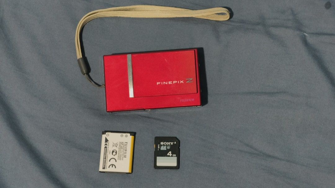Fujifilm Finepix z250fd (Category: Cameras) located in Cebu City. Submitted by jacsitems (Listing ID 1465978626, Image 1). Description: - Fujifilm Finepix z250fd - Condition: 7/10, fully functional, working flash - No visible scratches - LCD screen has blue tint but does not affect output. please see sample images taken from this unit. - Included accessories: Matching wrist strap, Sony 4GB memory card, and brand new NP-45 battery pack 📍 Cebu Cit