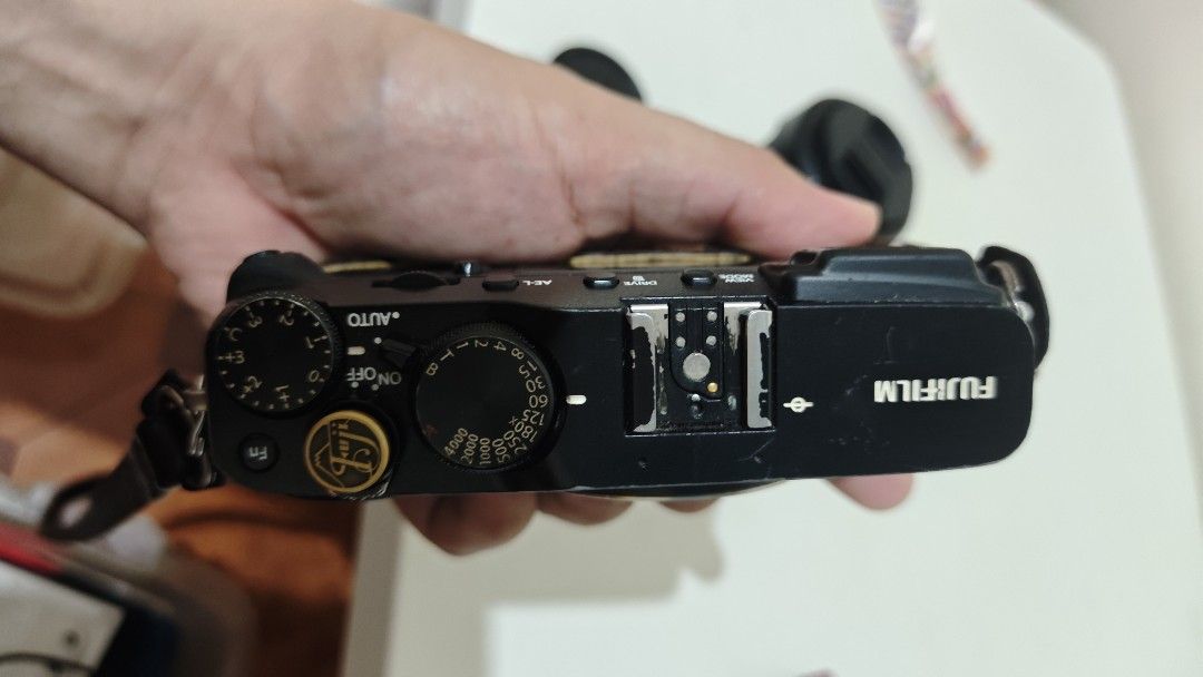 Fujifilm X-E3 Mirrorless Camera Bundle with Lens and Flash (Category: Cameras) located in Manila. Submitted by eyey02 (Listing ID 1466138054, Image 2). Description: - Fujifilm X-E3 mirrorless camera body in stylish brown leather half case - Includes lens with front cap, battery, battery charger, dedicated flash unit, and strap - Features tactile shutter speed and exposure compensation dials, plus a hot shoe mount - Clean rear screen and sensor - 