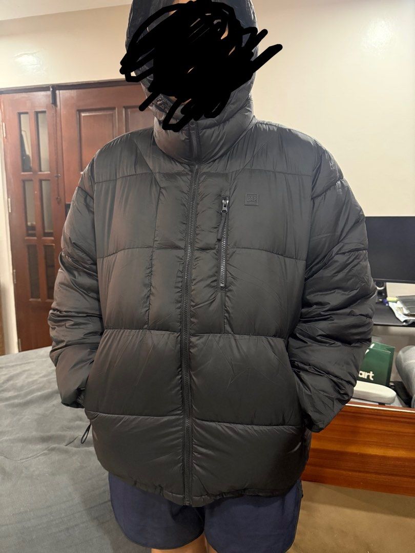 GAP Black Puffer Jacket XL (Category: Coats, Jackets and Outerwear) located in San Fernando. Submitted by hownottohoardstuffs (Listing ID 1466072370, Image 1). Description: - Brand: Gap - Color: Black - Size: XL - Material: 100% recycled polyester fill, shell, and lining - Features: Water-repellent fabric, hooded design, full front zip, and secure zipped chest pockets - Details: Iconic Gap chest tag branding - Condition/Vibe: Warm, chunky winter 