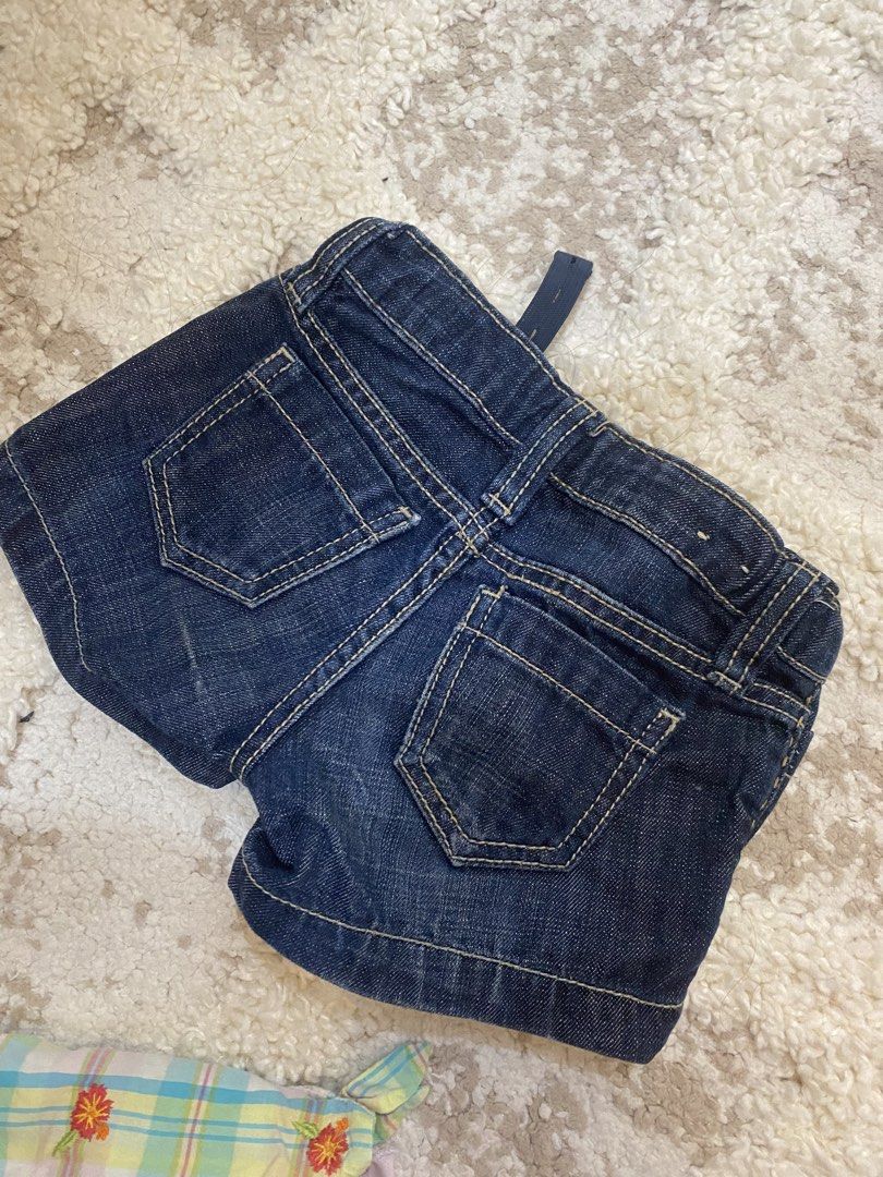 Gap Kids Denim Shorts Size 5 Regular (Category: Babies & Kids Fashion) located in Bulacan. Submitted by aksantos10 (Listing ID 1466073232, Image 3). Description: - Brand: Gap Kids - Size: 5 Regular - Color/Wash: Dark wash denim - Features: Front flap pockets with button closure, contrast stitching, and classic back pockets - Comfort: Adjustable elastic waistband inside for a custom fit - Condition: Great everyday shorts, ready to wear.