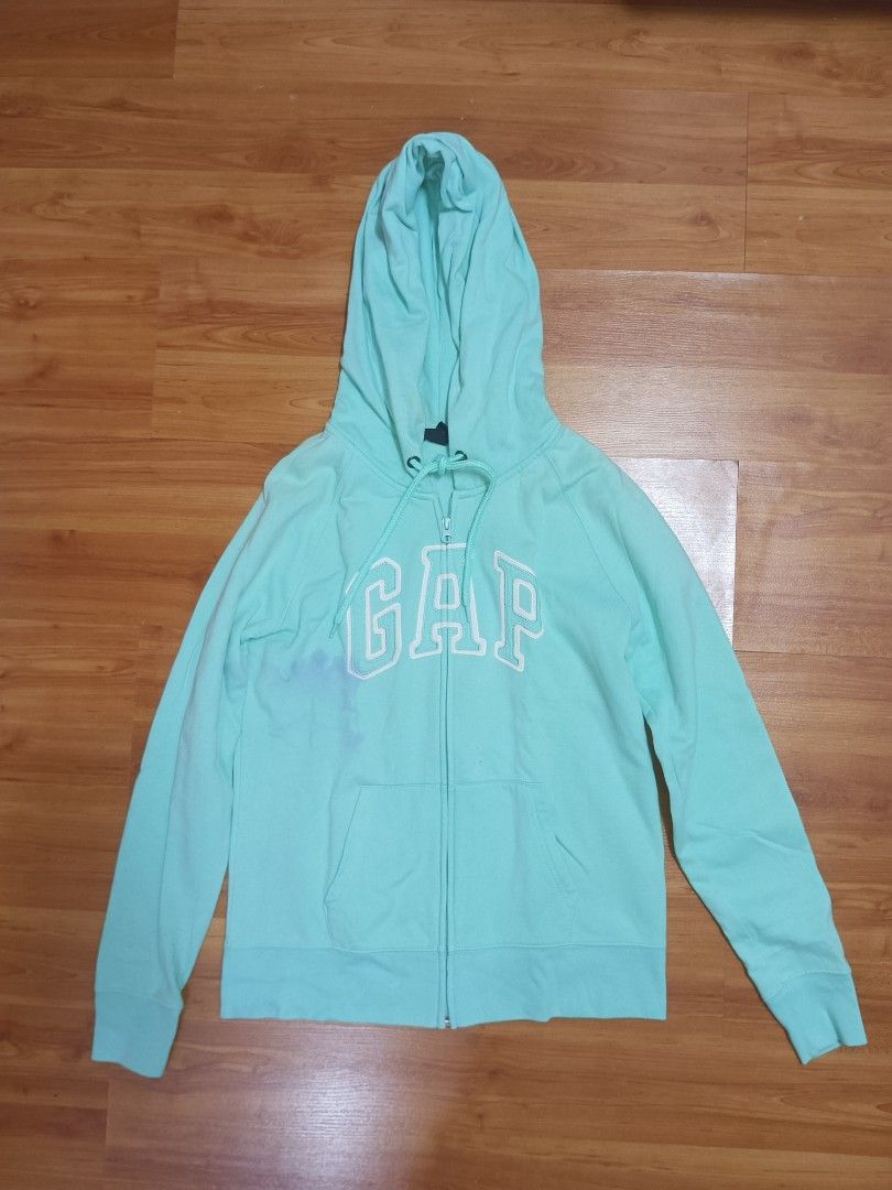 GAP Mint Green Hoodie Zip Up Jacket (Category: Coats, Jackets and Outerwear) located in Imus. Submitted by brightgem.de2dc2 (Listing ID 1466051079, Image 2). Description: GAP Mint Green Hoodie Zip Up Jacket Slightly Used With Visible Ink Stain on the right side.