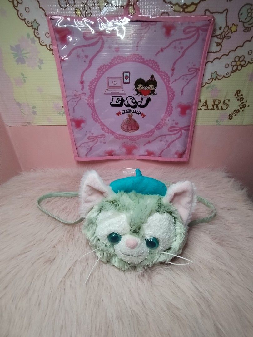 Gelatoni Disney Cat Sling Bag (Category: Plushies & Soft Toys) located in Paombong. Submitted by eandj.shop (Listing ID 1466045605, Image 3). Description: 🎀 Authentic Disney Gelatoni character plush backpack 🎀 Features a cute turquoise blue beret, big teal eyes, and long white whiskers 🎀 Made with ultra-soft, fuzzy green fur.
