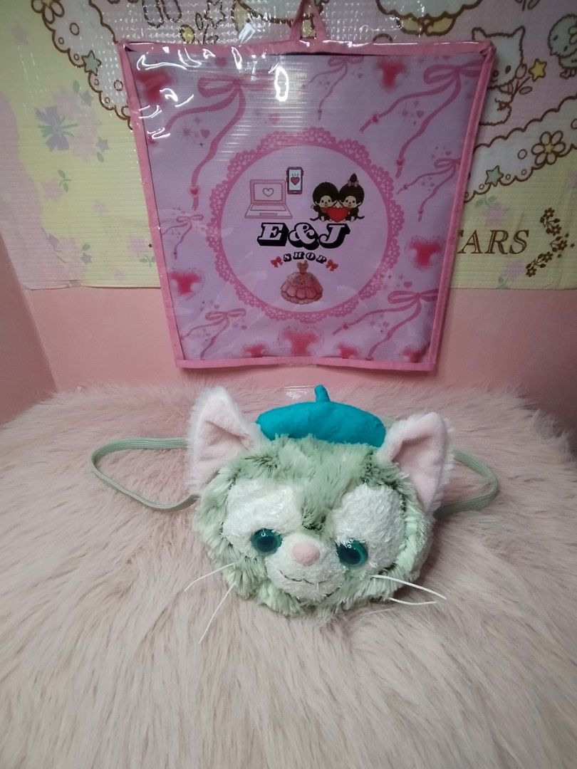 Gelatoni Disney Cat Sling Bag (Category: Plushies & Soft Toys) located in Paombong. Submitted by eandj.shop (Listing ID 1466045605, Image 2). Description: 🎀 Authentic Disney Gelatoni character plush backpack 🎀 Features a cute turquoise blue beret, big teal eyes, and long white whiskers 🎀 Made with ultra-soft, fuzzy green fur.