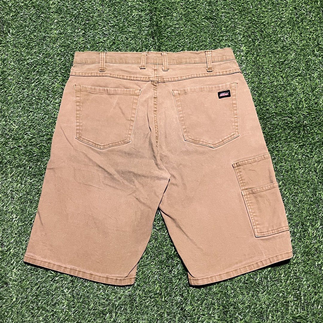 Genuine Dickies Cargo Shorts Brown Size 34 (Category: Shorts) located in Argao. Submitted by secondcyclecollection (Listing ID 1465961191, Image 1). Description: - Brand: Dickies - Color: Brown - Size: 34 - Style: Workwear / Cargo - Features: Multiple utility pockets on sides and back - Closure: Button closure with belt loops - Details: Dickies logo patch sewn above the right back pocket - Material: Sturdy and durable.