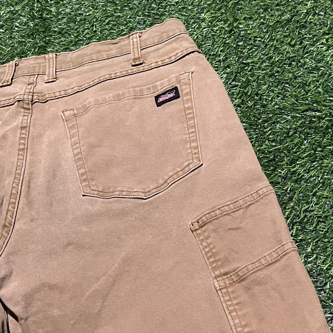Genuine Dickies Cargo Shorts Brown Size 34 (Category: Shorts) located in Argao. Submitted by secondcyclecollection (Listing ID 1465961191, Image 2). Description: - Brand: Dickies - Color: Brown - Size: 34 - Style: Workwear / Cargo - Features: Multiple utility pockets on sides and back - Closure: Button closure with belt loops - Details: Dickies logo patch sewn above the right back pocket - Material: Sturdy and durable.