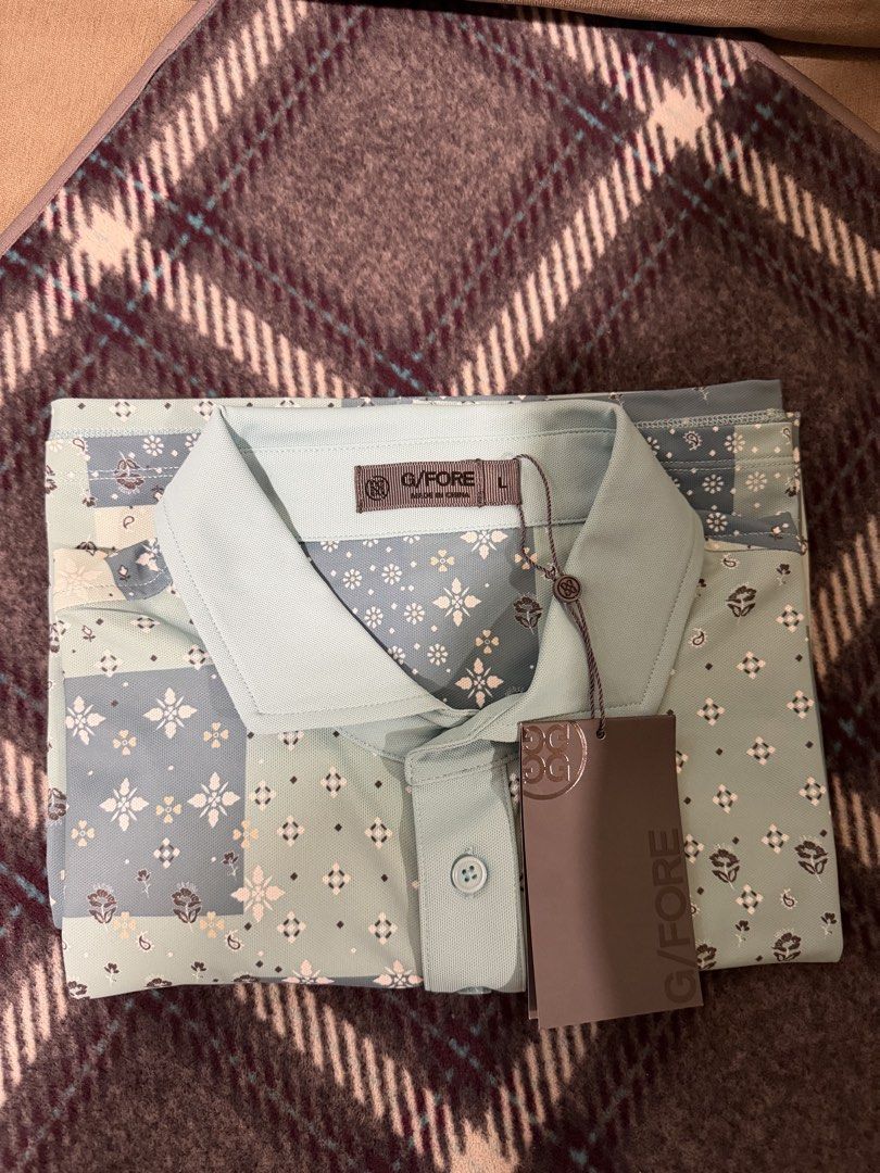 G/FORE Men (Category: Tshirts & Polo Shirts ) located in Quezon City. Submitted by 01_22 (Listing ID 1466075380, Image 1). Description: - Brand: G/FORE - Color: Light blue with all-over multi-block floral and bandana pattern - Size: Large - Condition: Brand new, unworn with original tags attached - Features: Standard collar and front button placket with soft fabric texture 2K NEGO!!! QC.