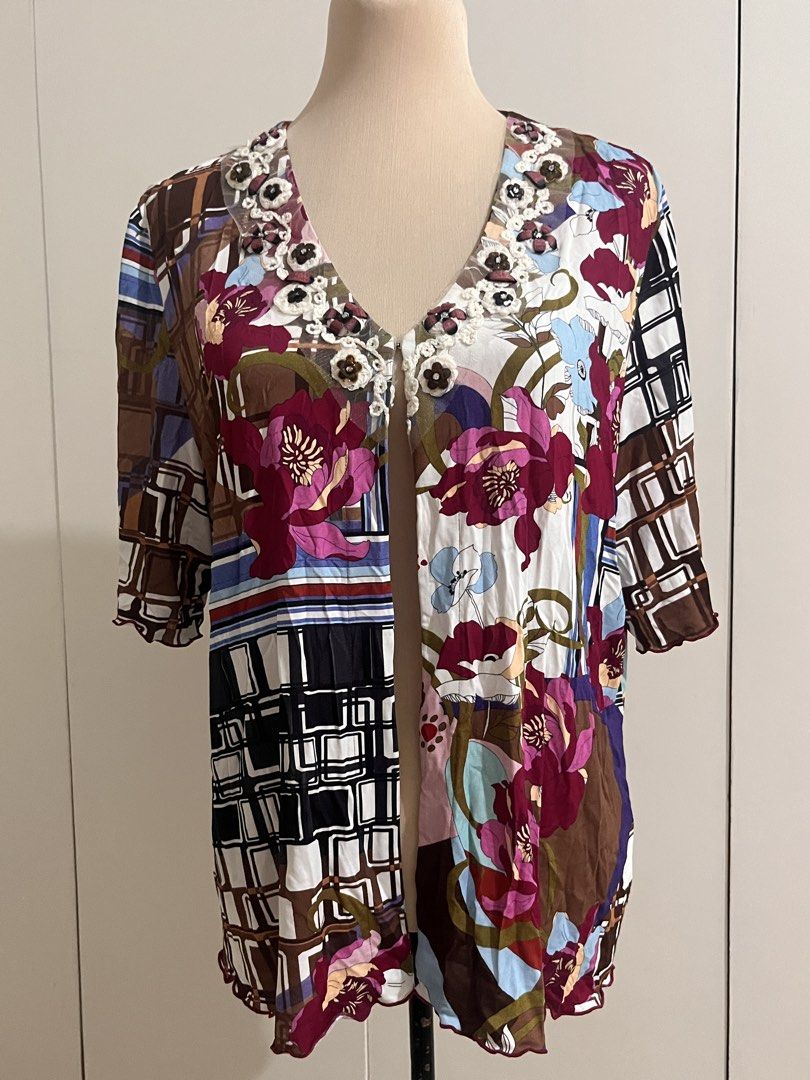 Ghinelli Floral Patchwork Open Cardigan Size 48 (Category: Coats, Jackets and Outerwear) located in Cabanatuan. Submitted by chinmndz (Listing ID 1465978557, Image 1). Description: Prices are negotiable !! ദ്ദി(˵ •̀ ᴗ - ˵ ) ✧ Feel free to ask for more details. - Brand/Model: Ghinelli open-front cardigan - Size: 48 - Design: Colorful mix of floral patterns, geometric blocks, and plaid prints - Details: V-neckline with crocheted lace flowers and be