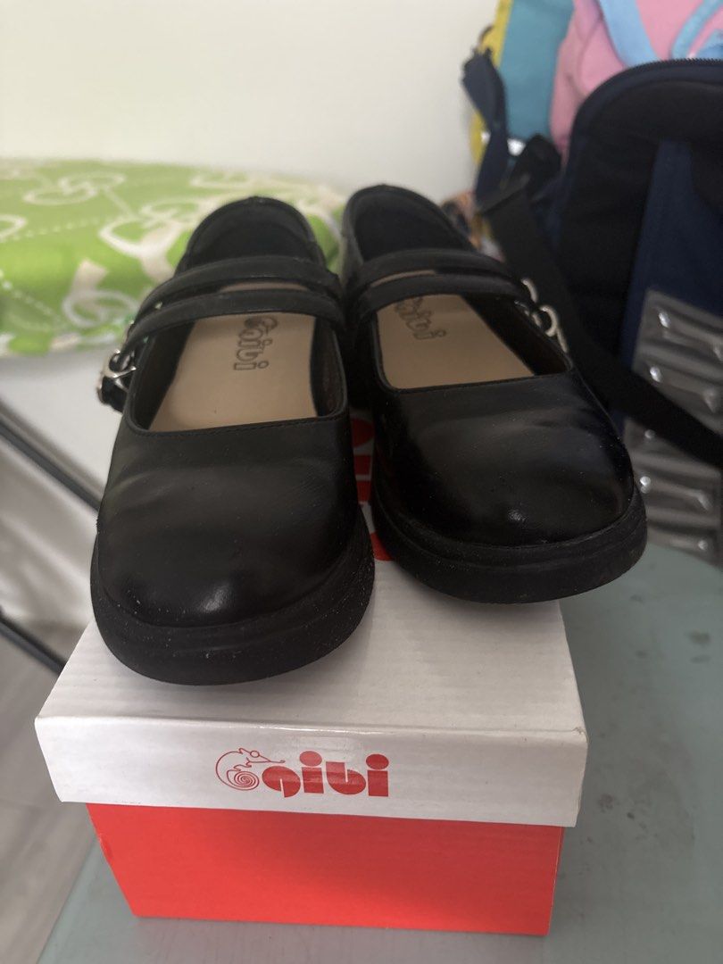 Gibi Black Mary Jane School Shoes (Category: Babies & Kids Fashion) located in Las Pinas. Submitted by Rainetots (Listing ID 1465968018, Image 1). Description: Gibi brand black shoes. Double strap design with metal buckles. Round toe, chunky sole. Original shoebox included in red and white. Clean insoles with visible Gibi logo print. Smooth synthetic leather material. size on tag: 29 best fit:6-7 years old.