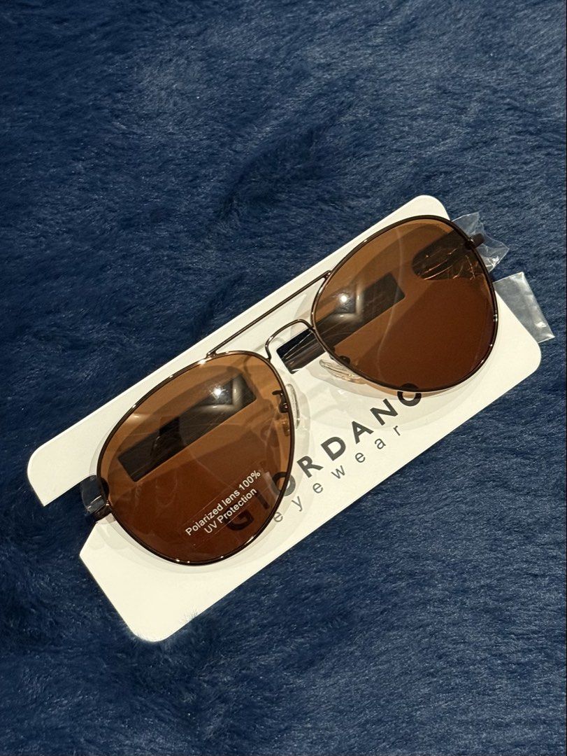 GIORDANO Polarized Aviator Sunglasses Brown (Category: Sunglasses & Eyewear) located in Manila. Submitted by snowflakesi (Listing ID 1465968601, Image 1). Description: - Style: Classic aviator with double bridge design - Lenses: Brown polarized with 100% UV protection - Frame: Slim metal frame Helping my ninang sell authentic sunglasses. ☀️ .