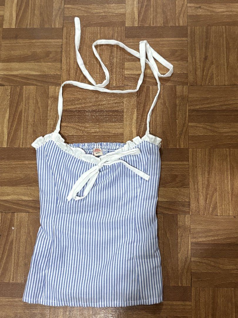 Girl Code Blue and White Striped Halter Top (Category: Sleeveless) located in Manila. Submitted by nykji96 (Listing ID 1465965244, Image 1). Description: - Brand: Girl Code - Size: Small - Design: Blue and white vertical stripes with white neck ties and front bow - Details: Sweetheart neckline with ruffle trim - Fit: Full smocked back for extra stretch and comfort - Material: Cotton blend - Condition: Brand new / Excellent.