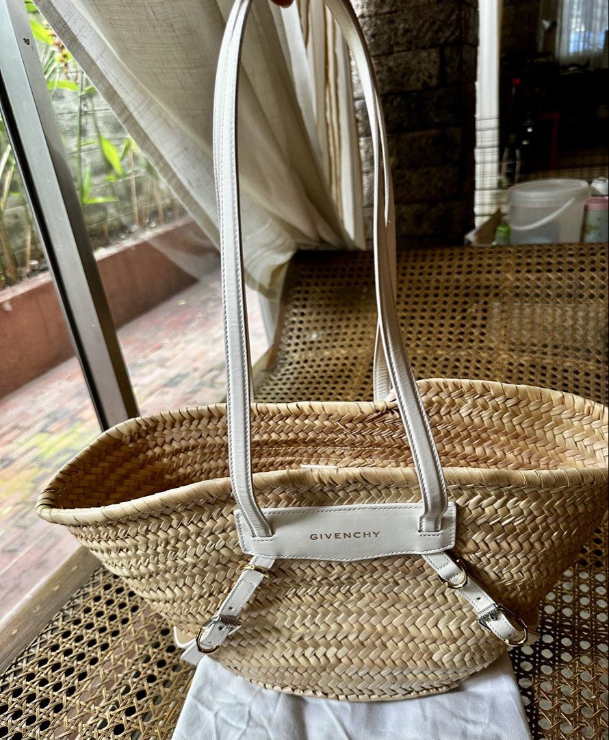 Givenchy Voyou Tote White Wicker (Category: Tote Bags) located in Makati City. Submitted by luchingching (Listing ID 1465988948, Image 3). Description: - Brand: Givenchy - Model: Voyou Tote Bag - Material: Natural wicker with white leather straps - Hardware: Silver-tone with front flap logo lettering - Features: Spacious woven body, dual top handles, and side buckle accents - Condition: Brand new with tags attached - Inclusion: Comes with origina