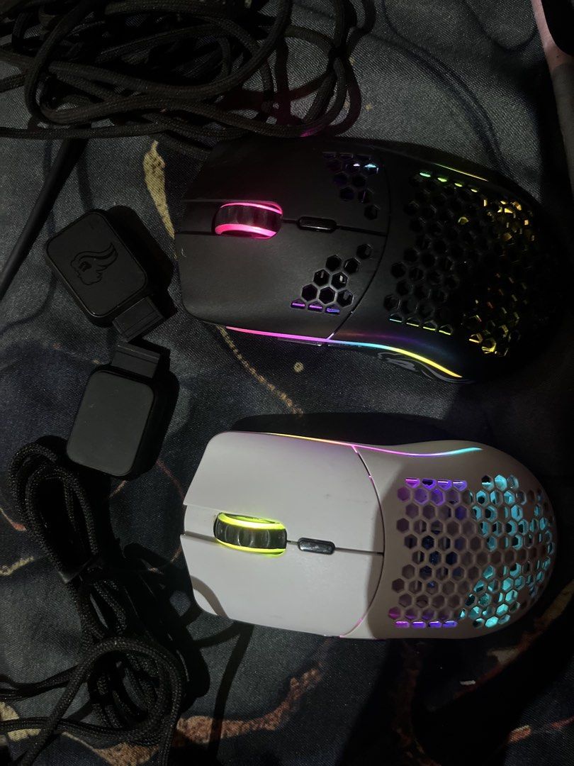 Glorious Model O & Model O Minus Wireless Mice Bundle (Category: Mouse & Mousepads) located in Quezon City. Submitted by alyxxz (Listing ID 1466019727, Image 1). Description: - Brand: Glorious - Items: Model O Wireless (Black) & Model O Minus Wireless (White) - Design: Lightweight honeycomb shell with vibrant RGB lighting - Condition: Fully tested and 100% working - Inclusions: Wireless adapters, extension dongles, and braided charging cables.
