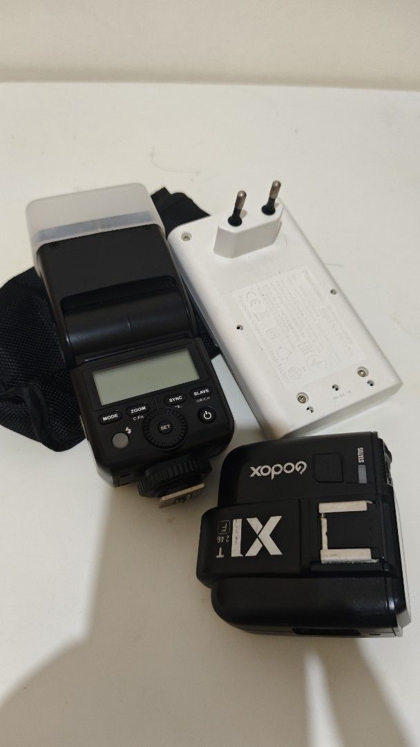 Godox X1T Flash Trigger and Speedlite Set (Category: Flashes) located in Manila. Submitted by eyey02 (Listing ID 1466137882, Image 1). Description: - Godox X1T wireless flash transmitter and camera speedlite flash included - Ready-to-use off-camera lighting setup - Comes with diffuser cap, protective pouch, and Panasonic battery charger - Clean units with minimal signs of handling - Tested and ready for shoots.