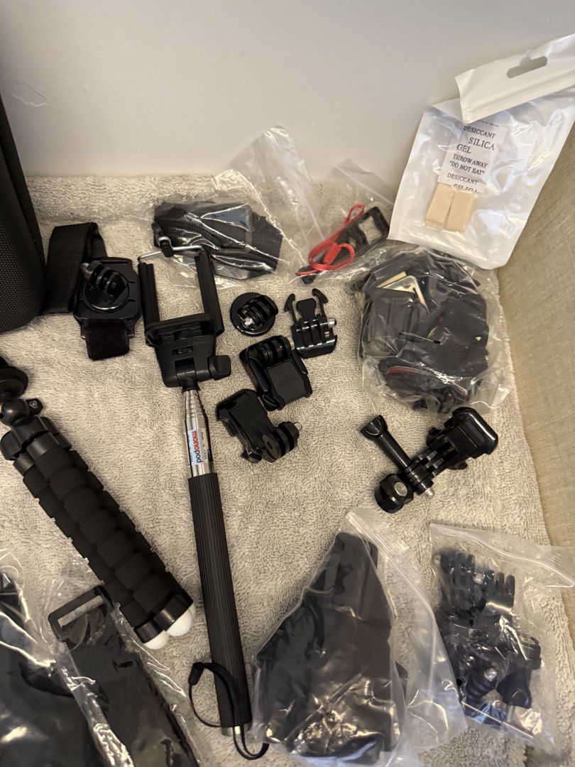 GoPro action camera accessories bundle with hard shell case (Category: Video Cameras) located in Santa Rosa. Submitted by alyssa21 (Listing ID 1465954423, Image 2). Description: - Massive action camera accessory bundle, great for travel and outdoor vlogging - Includes hard shell carrying case, yellow floating hand grip, flexible tripod, and selfie stick monopod - Comes with waterproof housing, white protective silicone sleeve, various mounting bu