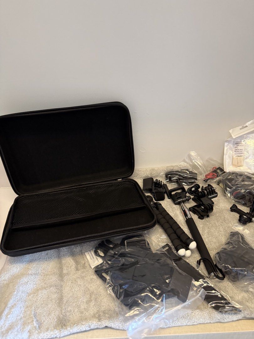 GoPro action camera accessories bundle with hard shell case (Category: Video Cameras) located in Santa Rosa. Submitted by alyssa21 (Listing ID 1465954423, Image 1). Description: - Massive action camera accessory bundle, great for travel and outdoor vlogging - Includes hard shell carrying case, yellow floating hand grip, flexible tripod, and selfie stick monopod - Comes with waterproof housing, white protective silicone sleeve, various mounting bu