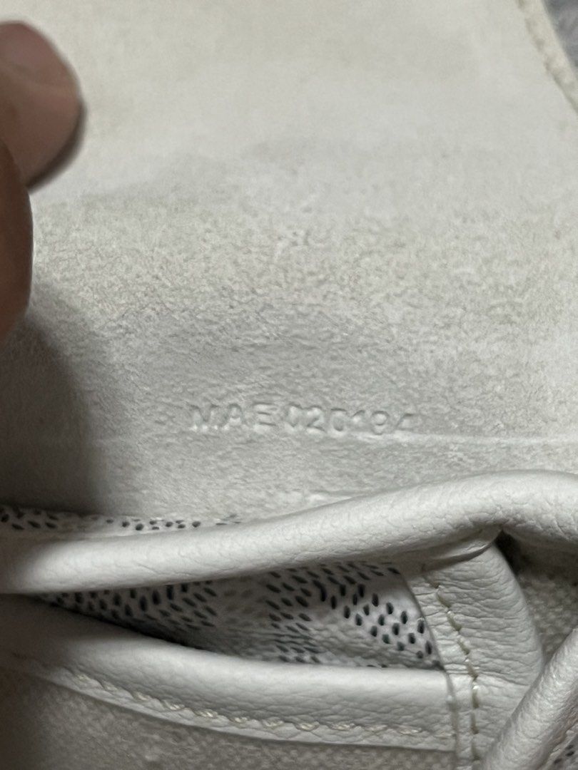 Goyard White Belvedere Backpack Purse (Category: Luxury Bags & Wallets) located in Victorias. Submitted by lan1877 (Listing ID 1466052118, Image 3). Description: White Goyard backpack with classic chevron canvas pattern. Structured flap top with buckle strap closure, top handle, and adjustable shoulder straps. Interior lined in light canvas with stamped Goyard Paris Made in France logo and serial number MAE020194. Hardware features engraved Goyar
