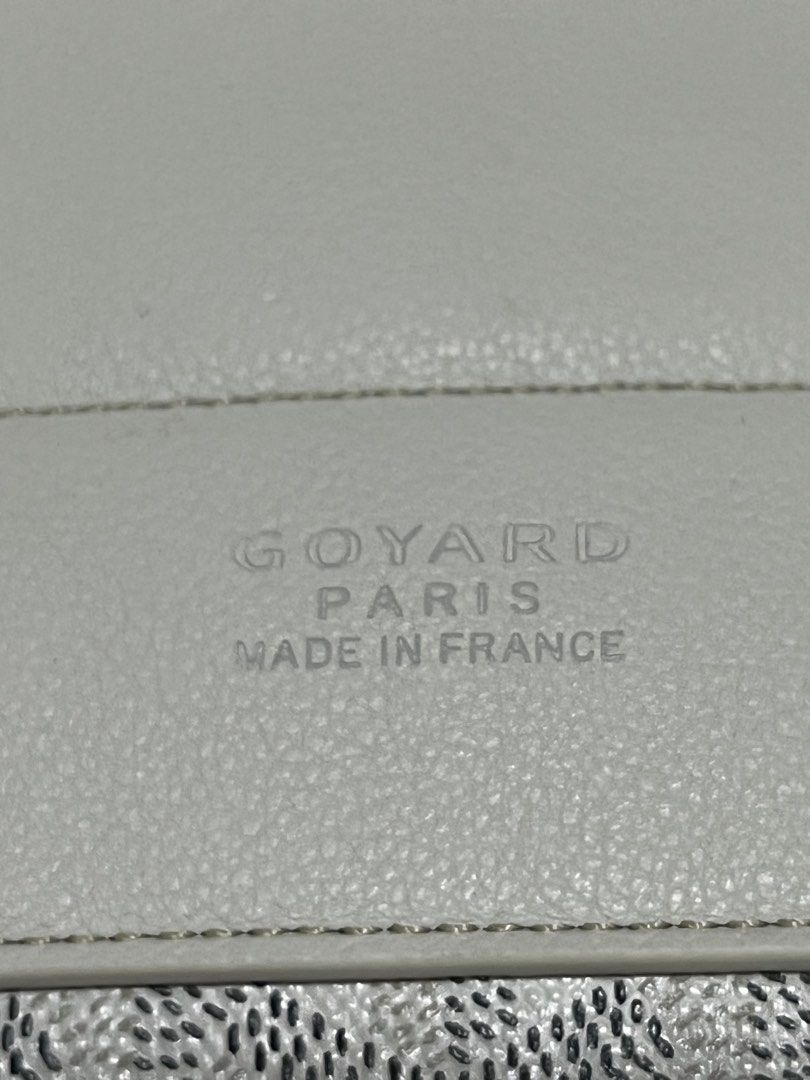 Goyard White Belvedere Backpack Purse (Category: Luxury Bags & Wallets) located in Victorias. Submitted by lan1877 (Listing ID 1466052118, Image 2). Description: White Goyard backpack with classic chevron canvas pattern. Structured flap top with buckle strap closure, top handle, and adjustable shoulder straps. Interior lined in light canvas with stamped Goyard Paris Made in France logo and serial number MAE020194. Hardware features engraved Goyar