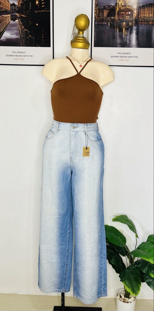 Gradient Blue Wide Leg Denim Jeans (Category: Jeans) located in Manila. Submitted by bengirlclothing (Listing ID 1466059123, Image 2). Description: - SIZE: 26-27 inches waist -LENGTH: 40 inches Style: Gradient blue wide leg jeans with tag attached - Wash: Light wash fading down the center with darker blue sides - Fit: High waist with button closure and belt loops - Pockets: Two functional back pockets .