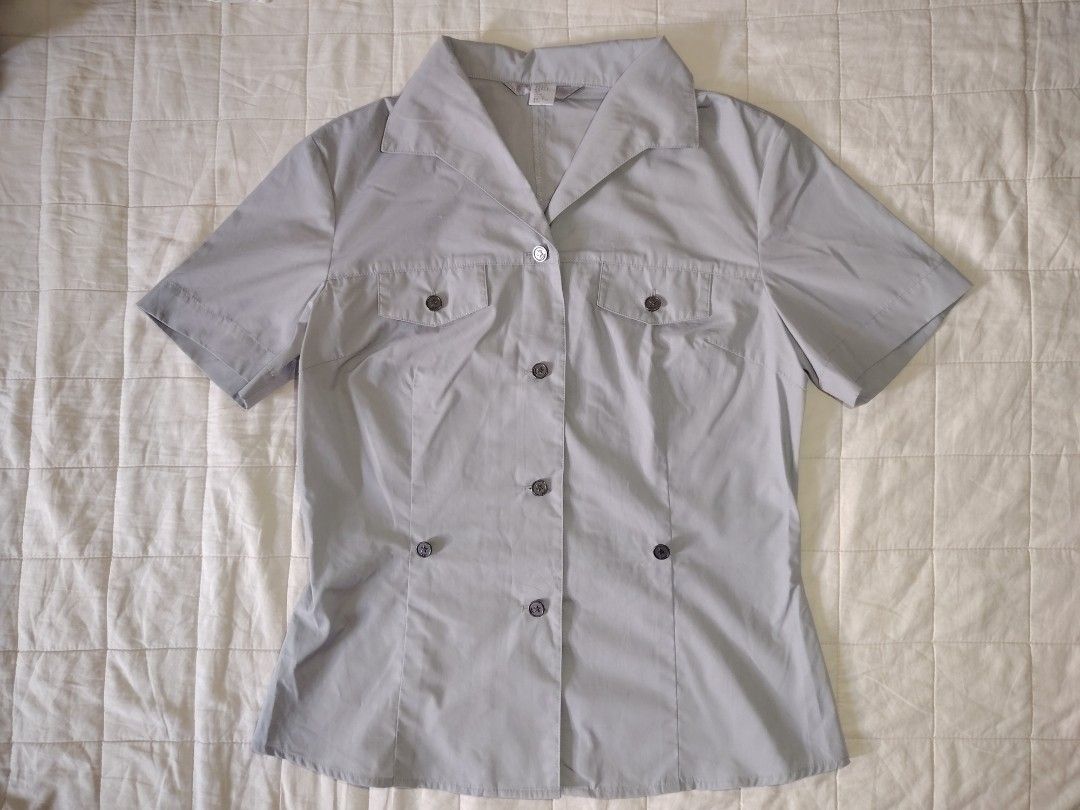 Gray Short Sleeve Button-Down Shirt (Category: Shirts) located in Tarlac. Submitted by your_finds (Listing ID 1466007757, Image 1). Description: Description: - Small ang size - Gray ang color - Working ang buttons - No pocket Condition: 10/10 / Excellent condition Medida size (inch) Bust: 34 Length: 22.