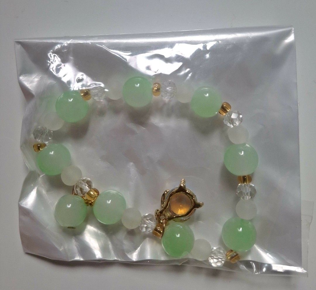 Green beaded bracelet with charms (Category: Bracelets) located in Taguig. Submitted by fits.for.less (Listing ID 1466100466, Image 2). Description: 60 pesos MOP: Gcash MOD: lalamove/grab, pick-up if malapit lang.