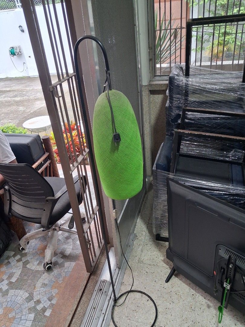 Green fabric shade arc floor lamp (Category: Lighting) located in Taguig. Submitted by ssvcn (Listing ID 1465975595, Image 2). Description: - Unique curved metal stand design - Vibrant green oval shade wrapped in fabric - Emits a warm and cozy glow when turned on - Long black cord with a convenient inline switch - Simple and quick setup - Perfect fit next to a couch or armchair.