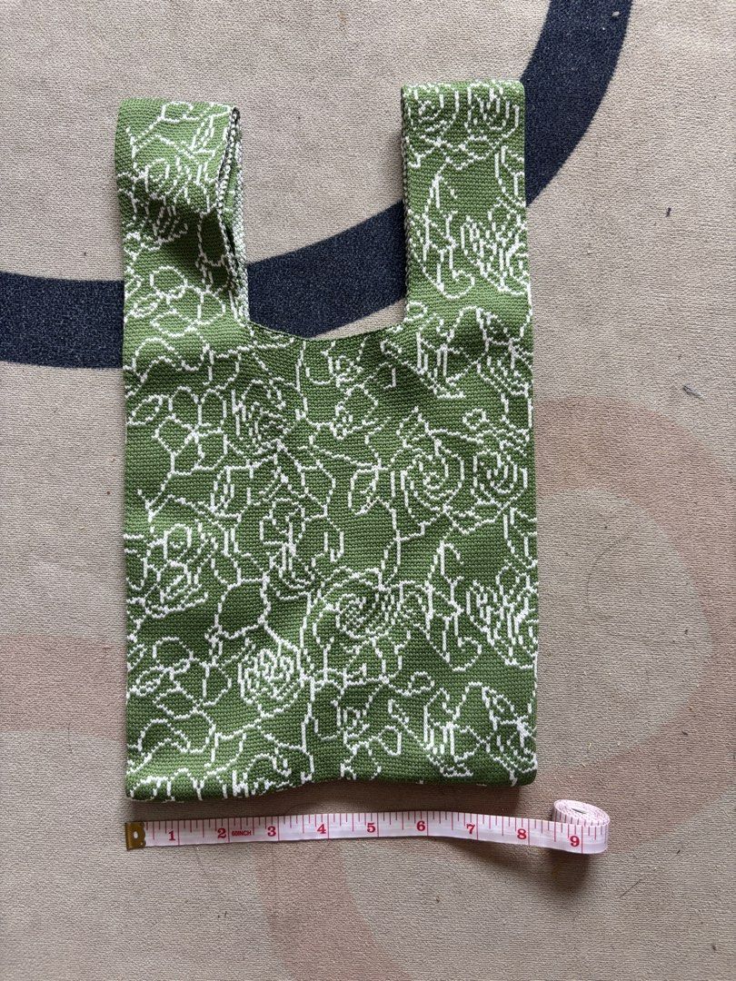 Green Floral Knit Bag (Category: Purses & Pouches) located in Taguig. Submitted by narulover (Listing ID 1465978152, Image 2). Description: - Green knit bag with white floral pattern - Dimensions: approx. 14 inches long x 9 inches wide - Lightweight and foldable fabric - Easy to store in a larger purse - Perfect handy grocery or market bag.