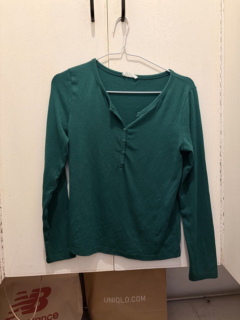 Green long sleeve button-down top Henley shirt (Category: Longsleeves) located in Pasay City. Submitted by notellyyyy (Listing ID 1465994886, Image 1). Description: - Color: Dark green - Style: Long sleeve with henley neckline and button placket - Material: Soft and comfortable fabric - Fit: Comfortable, great for everyday wear or layering.